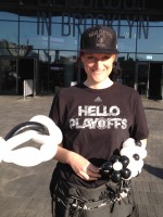 Kenwyn twisting balloons at Brooklyn Nets game